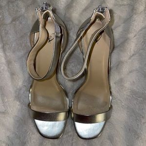 Silver dress sandal with ankle strap and 1/5” platform. Windsor size 10